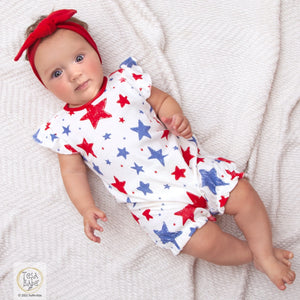 Baby girl bubble romper with stars print in red, white & blue! She'll be outfitted cute and comfy in this super-soft 100% cotton rib material. Buttons at back and snaps underneath for easy on and off.  Complete the look by adding optional headwear. Machine Wash Gentle. Tumble Dry Low.