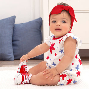 Baby girl bubble romper with stars print in red, white & blue! She'll be outfitted cute and comfy in this super-soft 100% cotton rib material. Buttons at back and snaps underneath for easy on and off.  Complete the look by adding optional headwear. Machine Wash Gentle. Tumble Dry Low.